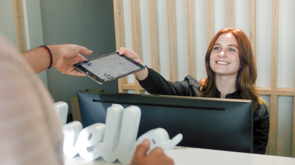 NeuMed reception — staff greeting a patient